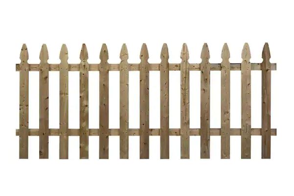 Wooden picket fence with scalloped top