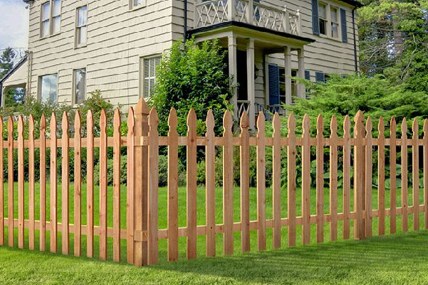 Wooden fence surrounding a house.