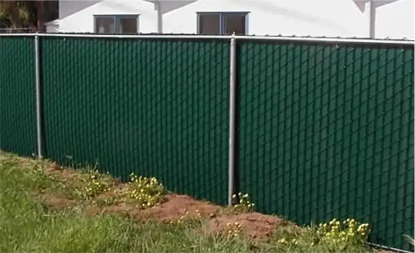Green chain-link fence with flowers